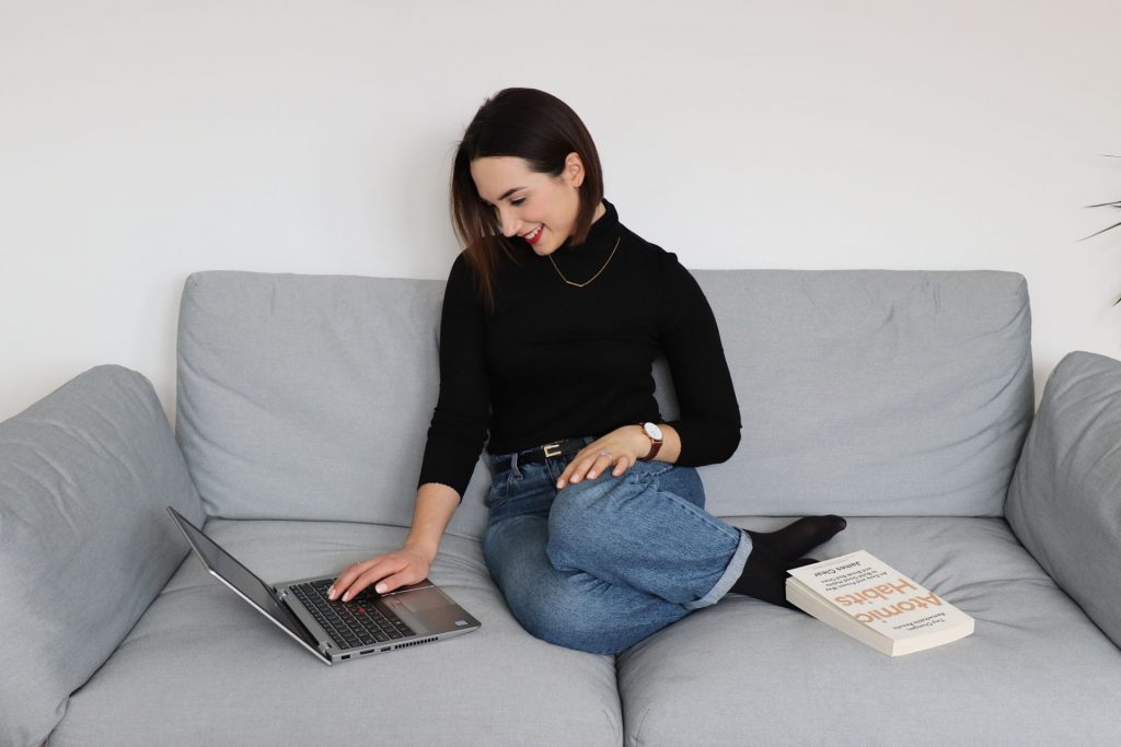 Tea on the sofa with a book Atomic Habits